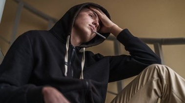 Stressed man smoking a cigarette