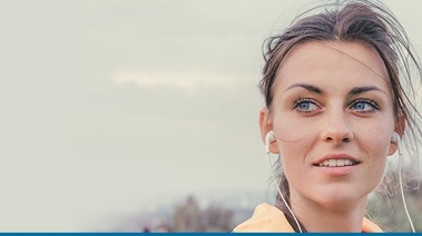 Woman running with headphones in her ears
