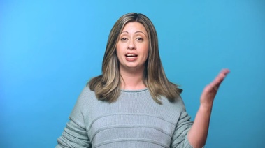 A woman against a blue background, promoting the idea of rewarding oneself with saved money.