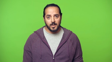 A man in a hoodie, symbolizing the struggle of resisting cravings during a drive.