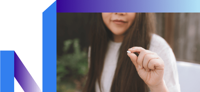 Woman holds lozenge and doesn't think about smoking