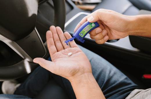 Person popping lozenge. They aren't thinking about smoking.
