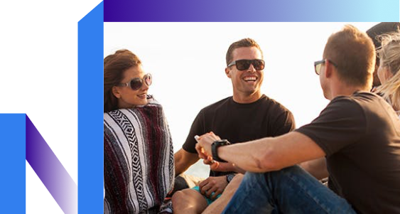 Three individuals in sunglasses relax on a boat, enjoying a sunny day.