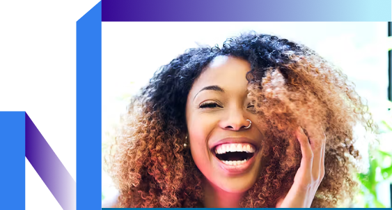 A woman with the curly hair laughing.