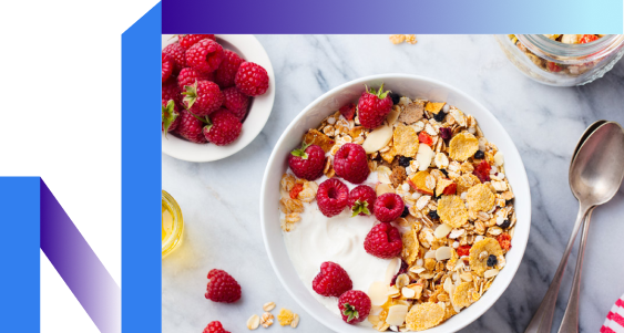 A bowl of cereal topped with berries, yogurt, and granola.
