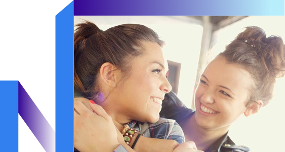 A woman with the curly hair laughing.