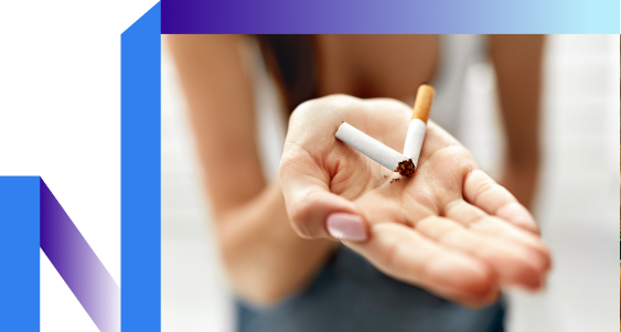 A woman confidently holds a cigarette, exuding calm and contemplation.