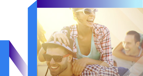 A man and woman smile brightly together