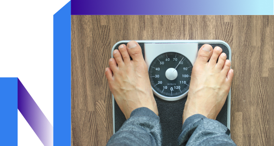 Man weighs himself on scale