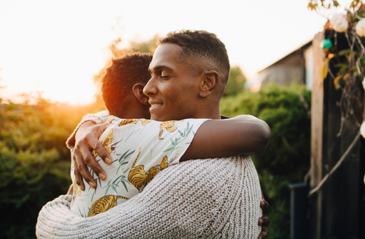 2 guys hug it out while they don't think about smoking