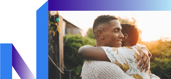 2 guys hugging it out over not thinking about smoking