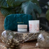 Phytoceane pouch, Destination Ocean Wrinkle Smoothing Cream, and Phytoceane Summer Garden Candle sitting side by side.