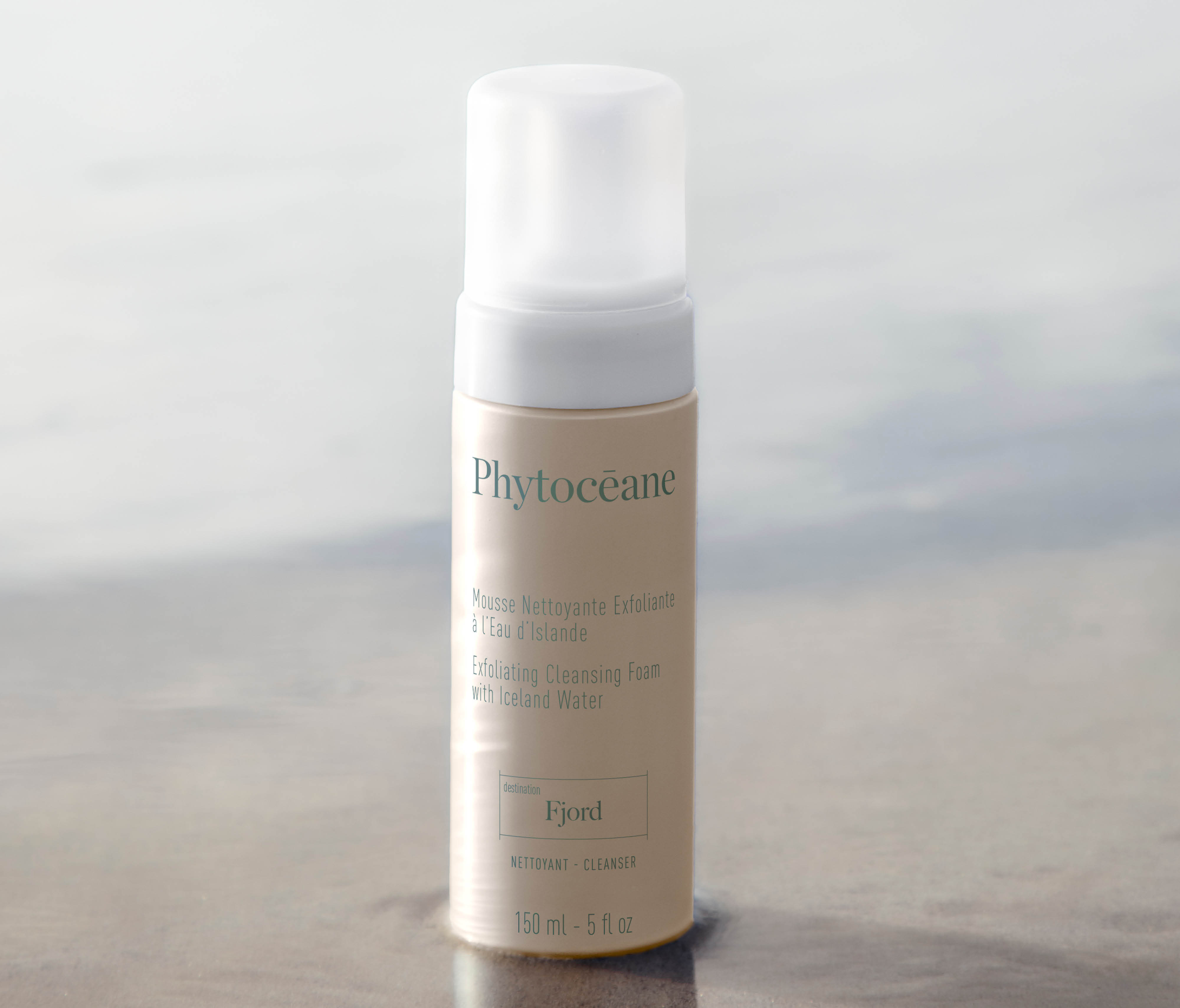 Fjord  Exfoliating Cleansing Foam with Iceland Water sitting in sand