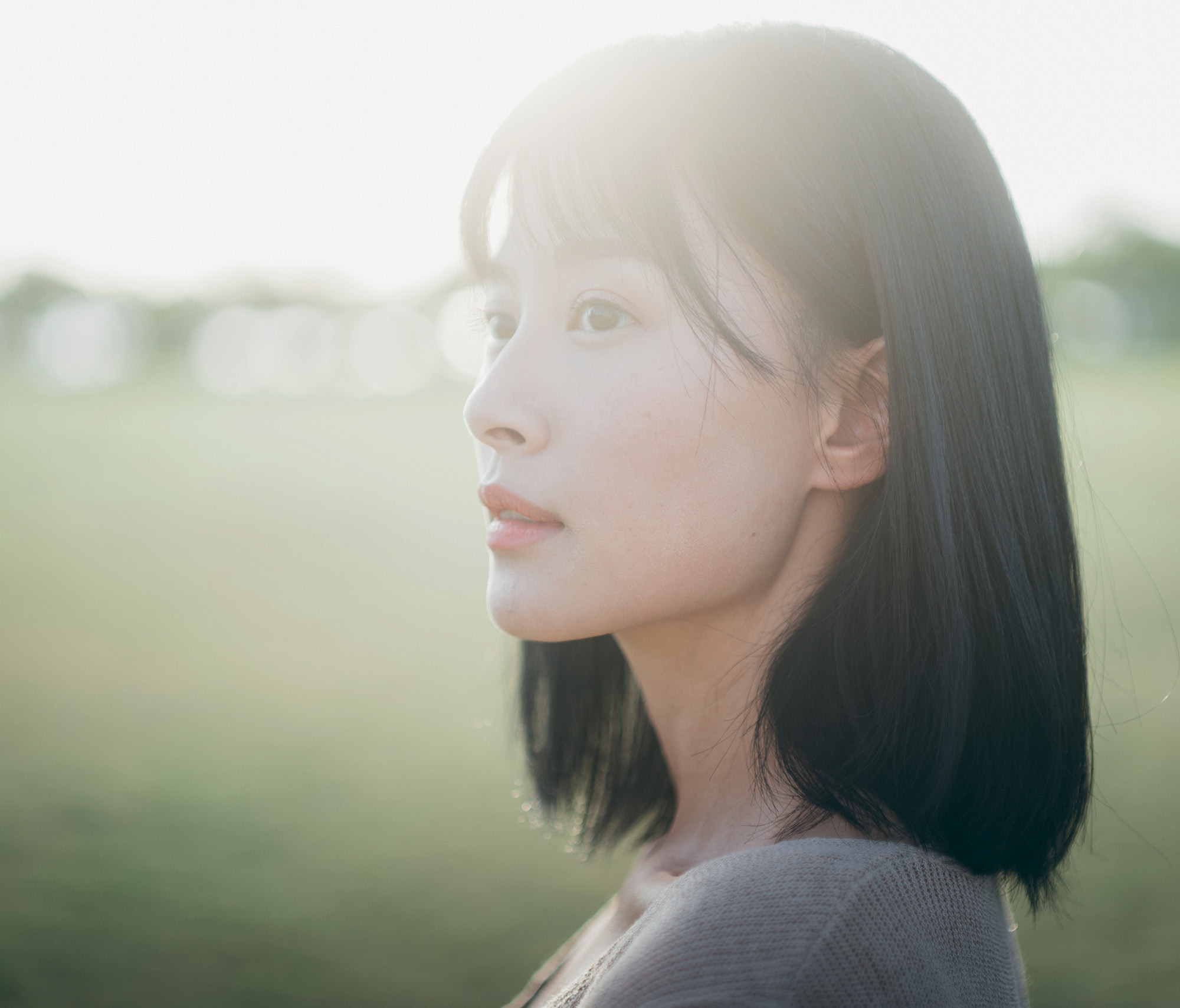 A woman gazing off into the distance.