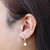 14K Gold Filled Fleur De Lis White Bello Opal Drop Earrings Model