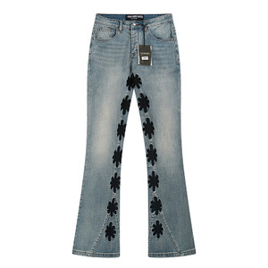 Light Wash Flared Jeans with Black Cross Appliqué