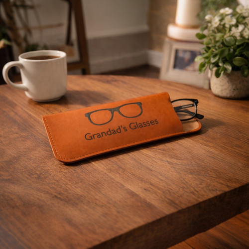Personalised leather glasses case on living room table.