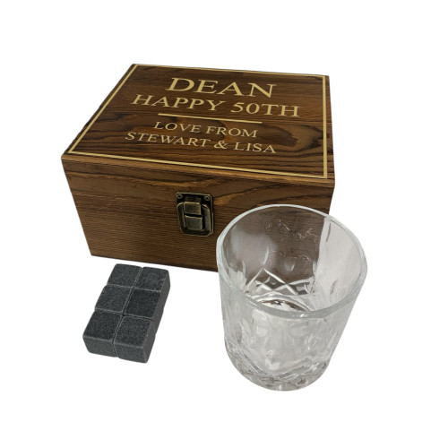 Personalised rustic wooden whisky gift set with Happy 50th birthday message. Displayed with whisky glass and stones. Perfect birthday gift for whisky lovers