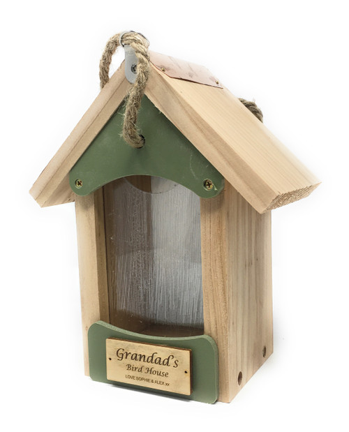Handcrafted wooden bird barn feeder with engraved wooden message plate, filled with gourmet bird food and nesting wool, perfect for garden wildlife enthusiasts