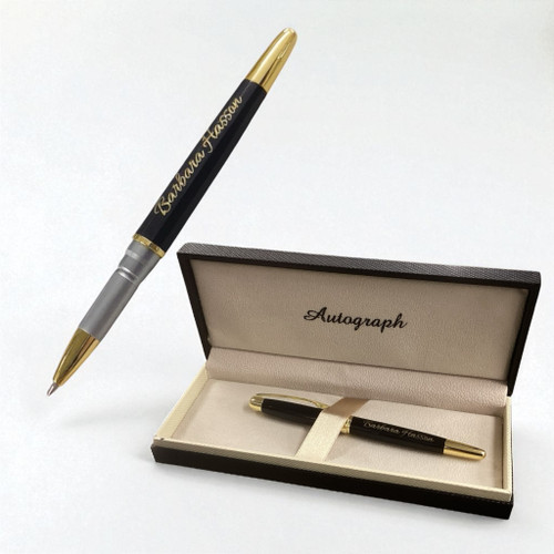 A customised rollerball pen gift set. Pen has a shiny black finish with gold plated parts and pocket clip. Customised text on pen. Supplied in luxury presentation gift box.