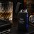 Lifestyle image of black USB ARC lighter With Dad Happy 60th Birthday engraved on the front. On a desk displayed next to a whisky glass.