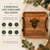 A square wooden serving tray with dark brown leather handles, featuring an engraved Highland cow illustration and the text The Miller Family EST. 1989. The tray is displayed alongside text detailing gift occasions and personalisation.