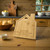 Personalised house shaped bamboo chopping board engraved with names and message