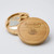A wooden circular charcuterie board. Made from rubberwood with sliding opening lid to reveal 3 cheese servers. Customised text on top of lid with engraved stunning cheese and grapes design.