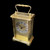 A gold plated carriage clock with easy to read roman numerials. Customised engraved message plate on top. Easy comfortable grip handle