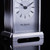 A silver plated carriage clock with easy to read roman numerials. Customised engraved message plate on top. Easy comfortable grip handle