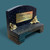 a small black rectangular bench  memorial  keepsake. Made from black resin with decorated gold  flowers. Personalised gold coloured plate  showing personalised message.