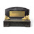 A small black rectangular bench  memorial  keepsake. Made from black resin with decorated gold  flowers. Personalised gold coloured plate  showing personalised message.
