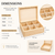 A light-coloured wooden storage box with a hinged lid and six internal compartments. The box measures 21.7 cm in length, 16.6 cm in width, and 8.1 cm in height. Removable dividers allow for a single large storage space as shown.