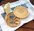 Custom engraved cheese board sliding open to reveal hidden stainless steel cheese knives