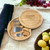 Personalised cheese board with hidden drawer and stainless steel cheese knives on kitchen worktop. Personalised cheese board with hidden drawer and stainless steel cheese knives on kitchen worktop.
