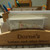 Close-up of engraved name on wooden letter rack – custom desk organiser gift