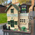 Handmade personalised Irish pub bird house – front view with engraved plaque in a garden setting