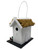 Side view of rustic Irish cottage-style bird house with personalised wooden plaque