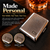 A rectangular chrome case with a textured crosshatch pattern on the lid, featuring an engraved rectangular plaque with the initials R.C. The text Made Personal, Your Initials. Your Name. Your Case. is visible alongside two circular insets.