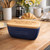 Personalised blue ceramic butter dish with engraved message on oak lid  displayed on decorative kitchen worktop