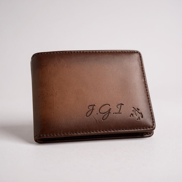 A unique burnished tan  bi fold pocket men's wallet. Made from genuine leather. Customised text on front. A unique burnished tan  bi fold pocket men's wallet. Made from genuine leather. Customised text on front.