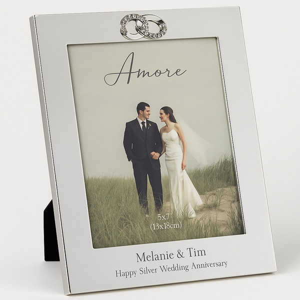 A silverplated wedding frame with 3d crystal entwined wedding rings at top. Engraved message of your choosing at bottom of the frame. Freestanding frame for displaying wedding memories.