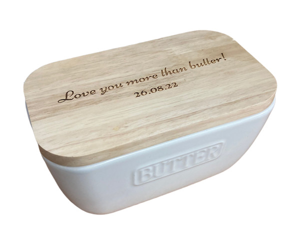 white ceramic butter dish with oak lid and engraved message