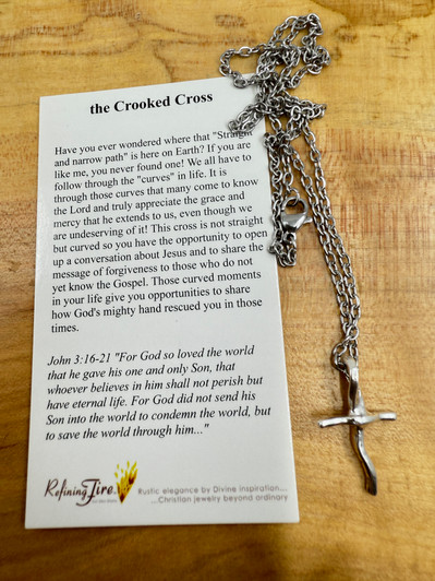 Shown is a Sterling Silver Crooked Cross available with a Sterling Silver Chain or Stainless Steel Chain. This cross is shown on a Stainless Steel Chain which is available in a 16", 18", 20", or 24" length. Please specify your needs in the drop down menu.  Shown is a Sterling Silver Crooked Cross available with a Sterling Silver Chain or Stainless Steel Chain. This cross is shown on a Stainless Steel Chain which is available in a 16", 18", 20", or 24" length. Please specify your needs in the drop down menu.