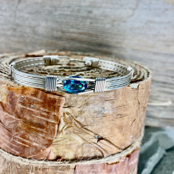 Rainbow Topaz is such a beautiful gemstone. This faceted stone offers a soft blue hue of color with variations of pink going through it. Please keep in mind since this is a Heat Irradiated gemstone, no two are alike. Slight variations will occur with each one sent as a custom order. 
