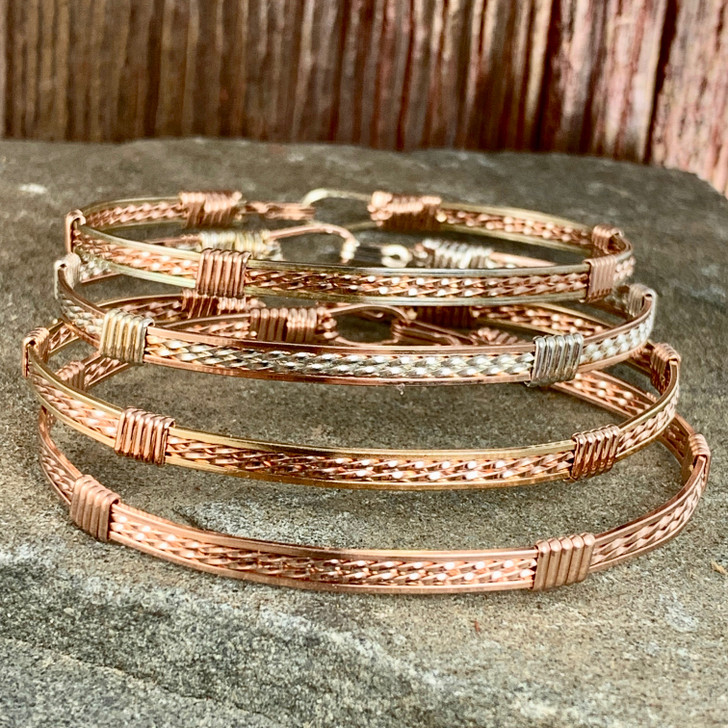 Bracelets. ornaments of copper wire Stock Photo by ©kopitin 58134223