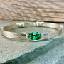Shown is an all silver classic band bracelet paired up with a synthetic Emerald, May's birthstone. Choose this or any number of other gemstones to create your next heirloom treasure from the Kimberley Jade - Wired Out Of Hand Collection. Handmade in USA. 
