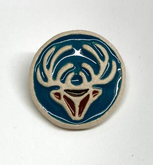 Stag brooch made from a white stoneware clay and coloured glazes