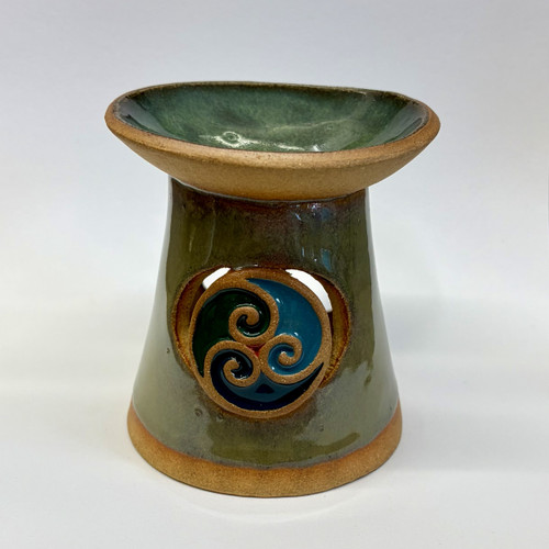 Oil Burner  Handmade and Crafted in a textured stoneware clay, carrying a tri-spiral motif and finished with stoneware glazes.