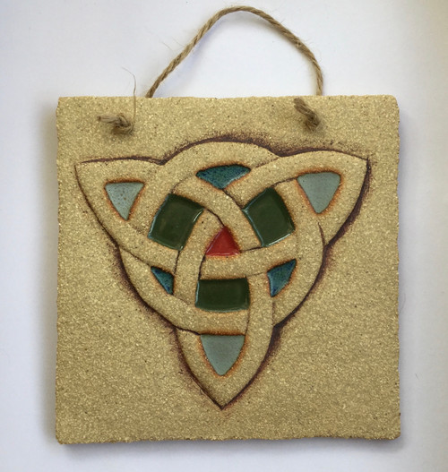 Trinity plaque made from textured stoneware clay, coloured glazes and oxide.
Hessian string added to hang.